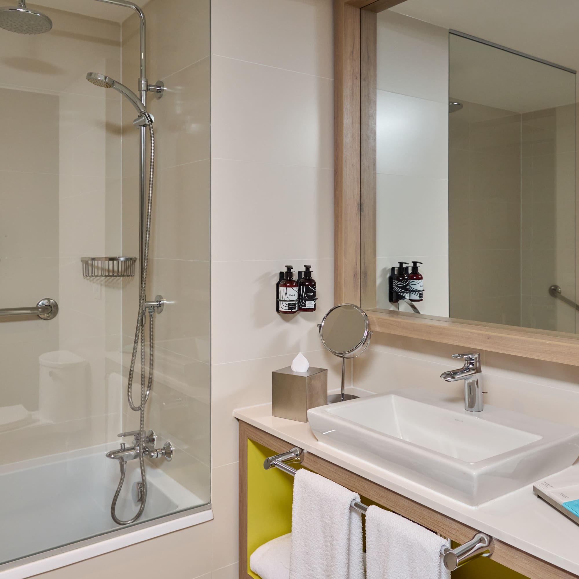 a bathroom with a shower and sink