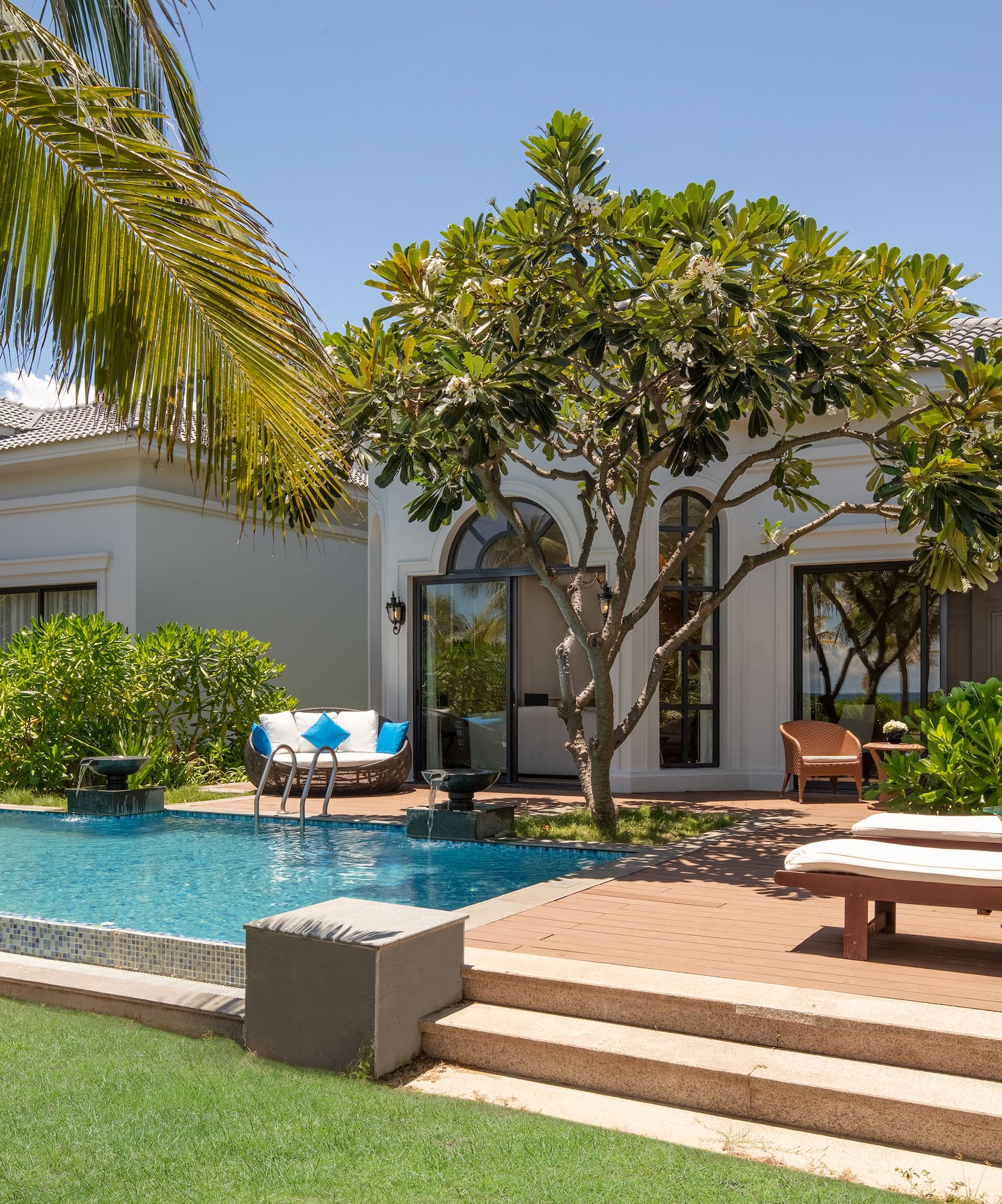 a pool in front of a house