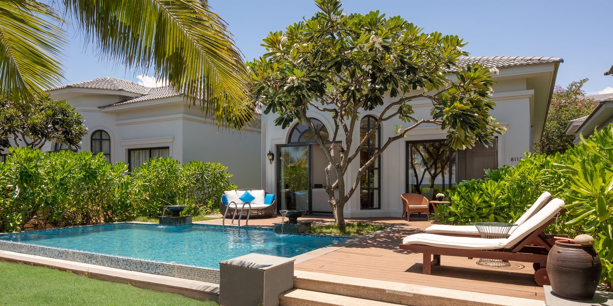 a pool in front of a house