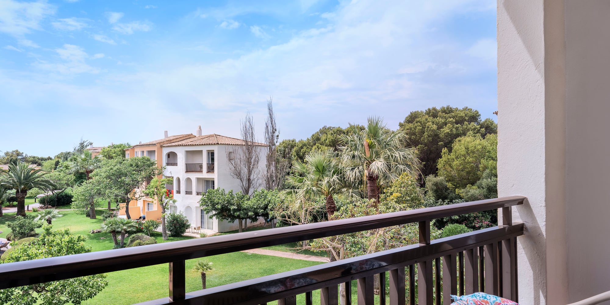 a balcony with a table and sunglasses on it