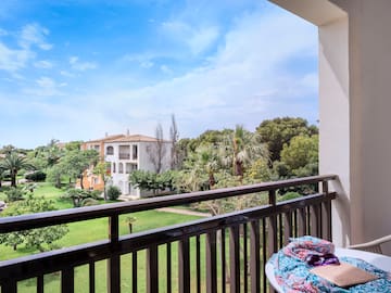 a balcony with a table and sunglasses on it
