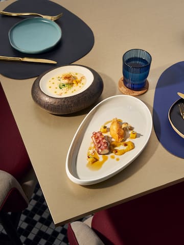 a table with plates and bowls of food