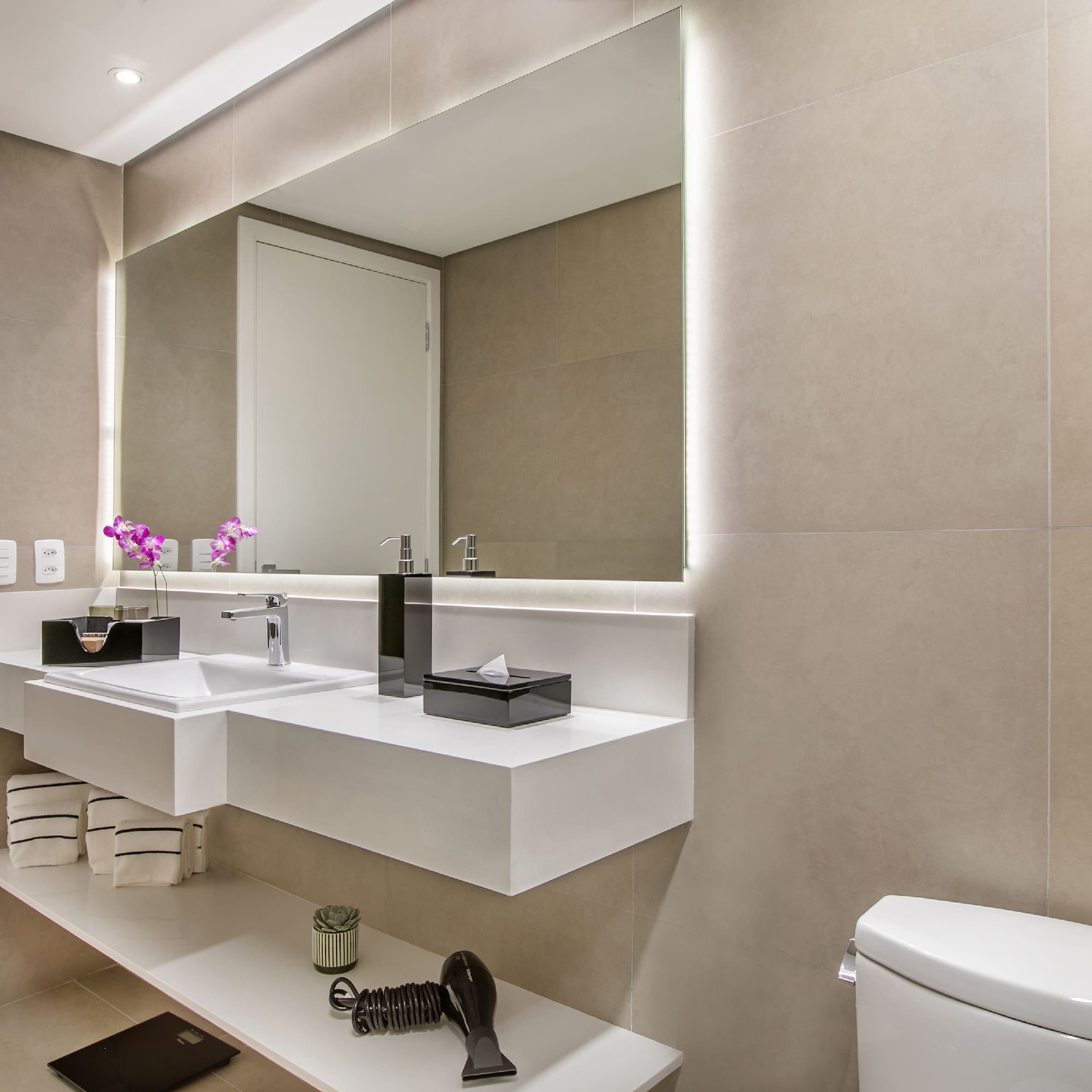 a bathroom with a mirror and sink