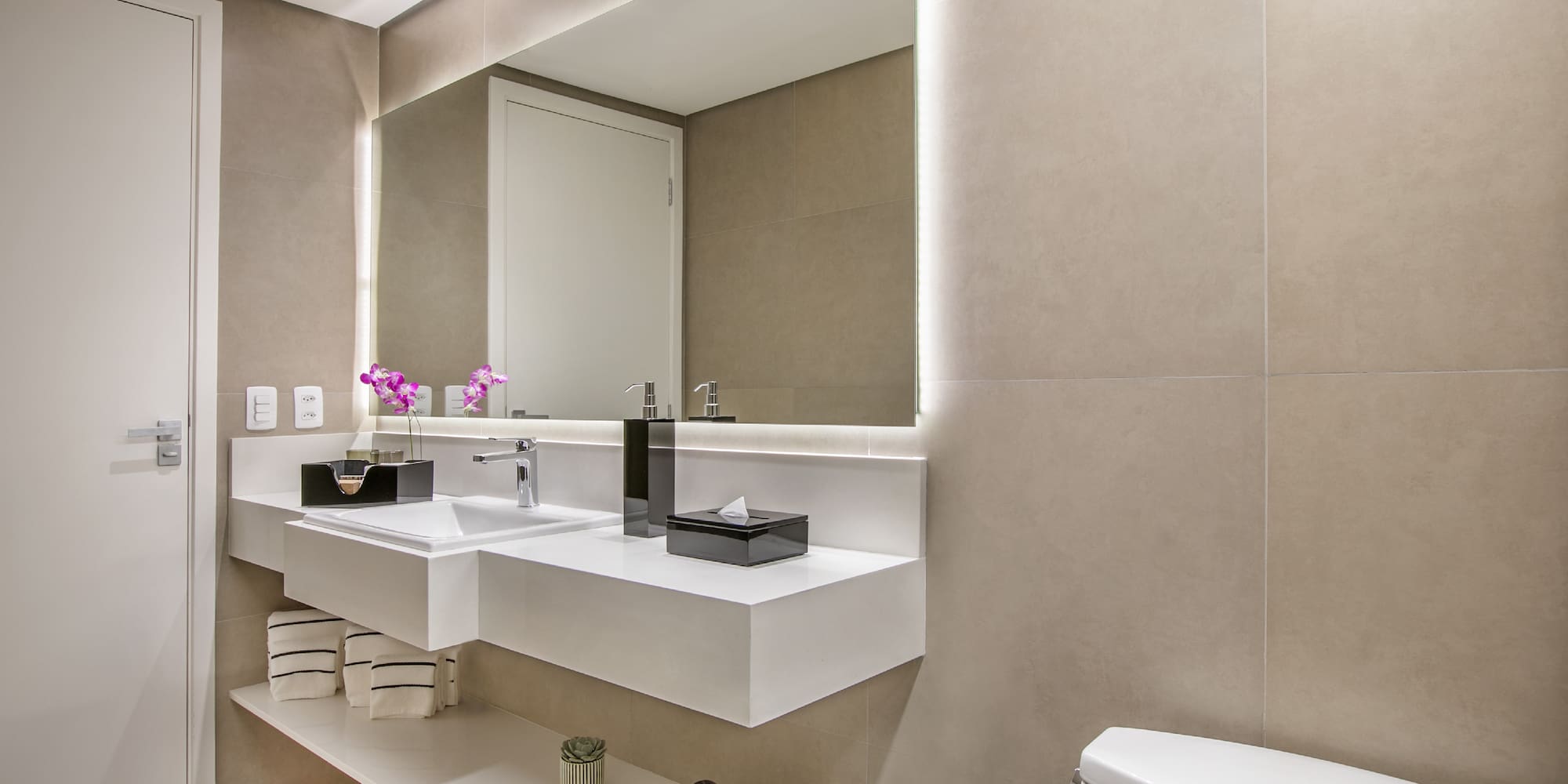 a bathroom with a mirror and sink