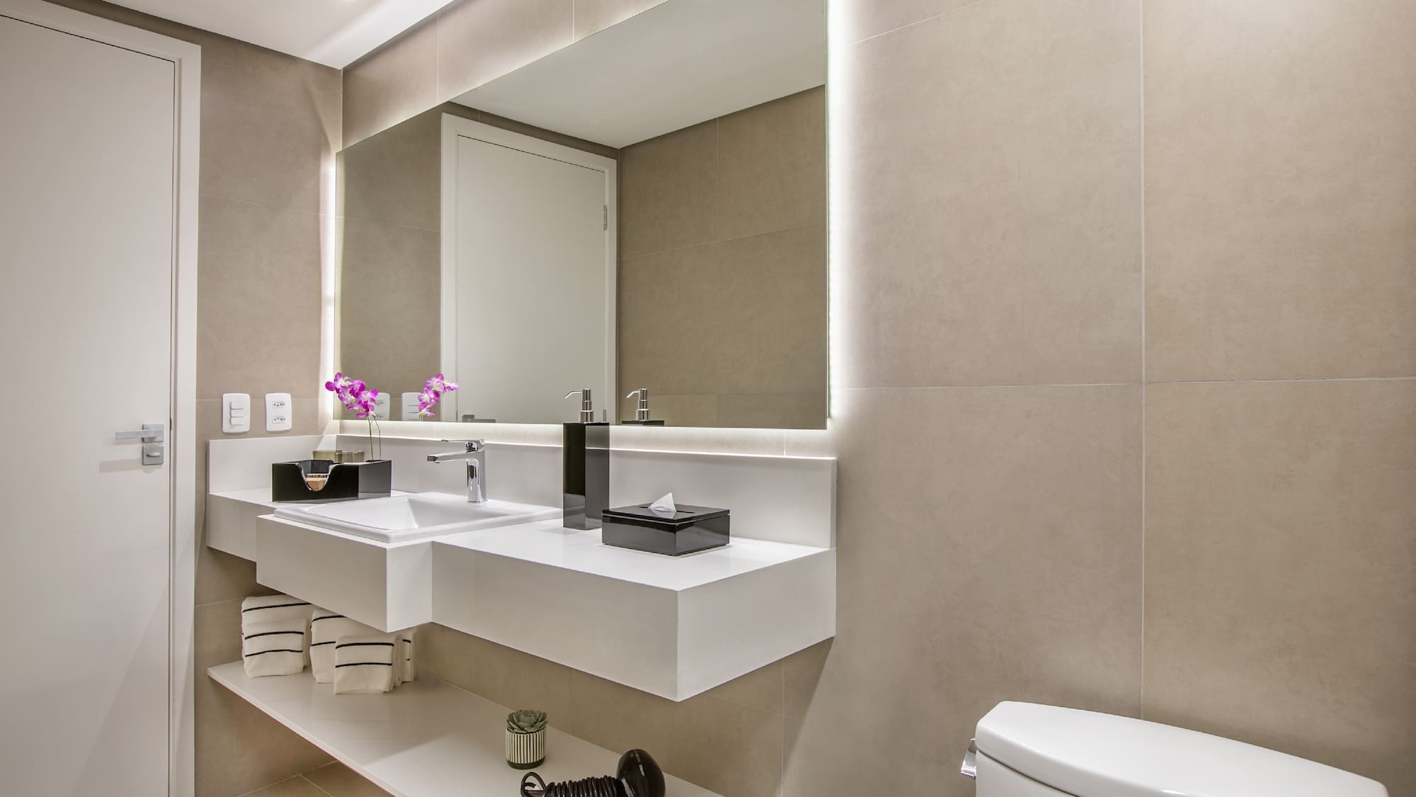 a bathroom with a mirror and sink