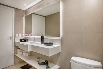 a bathroom with a mirror and sink