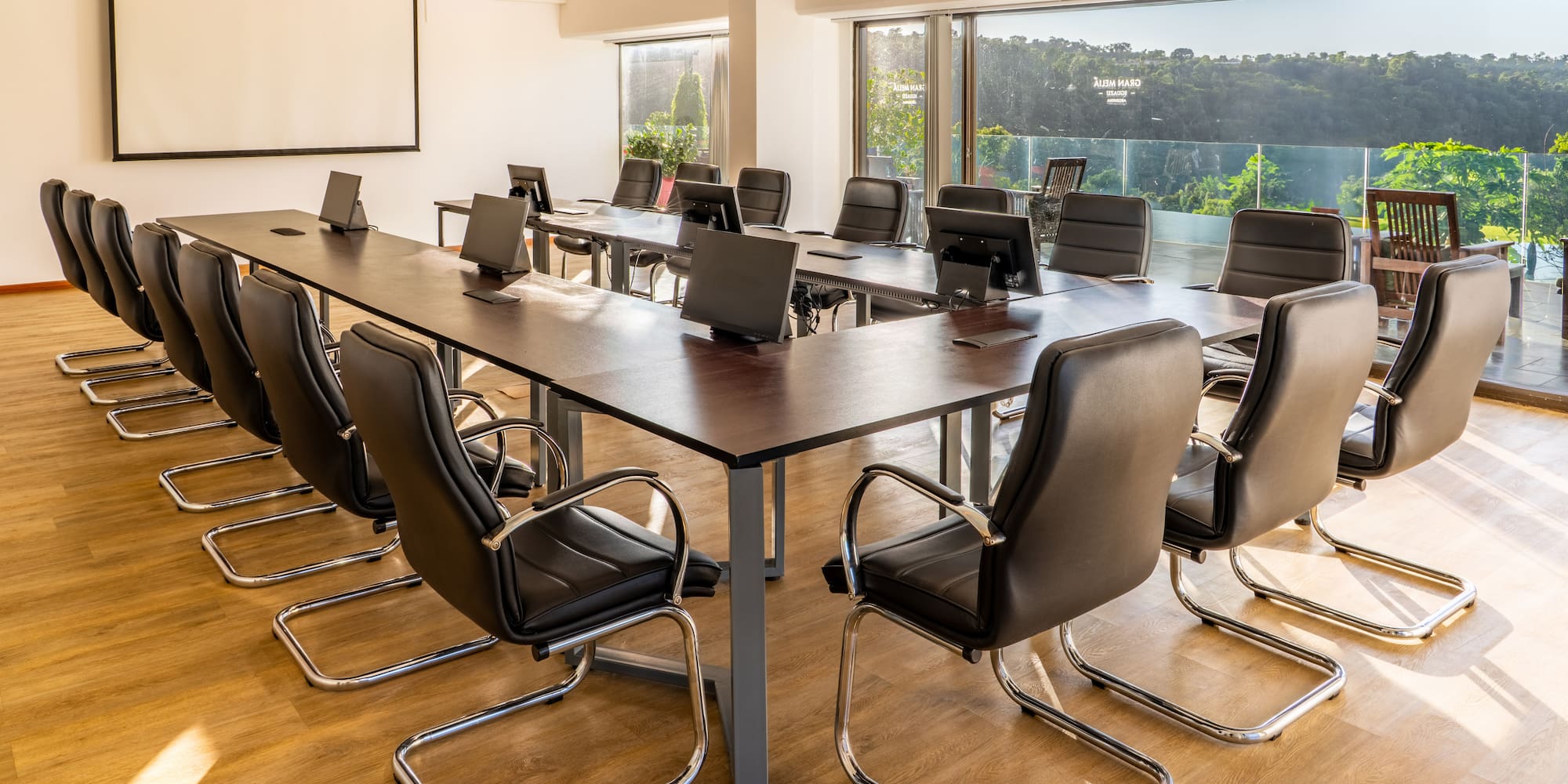 a conference room with a table and chairs