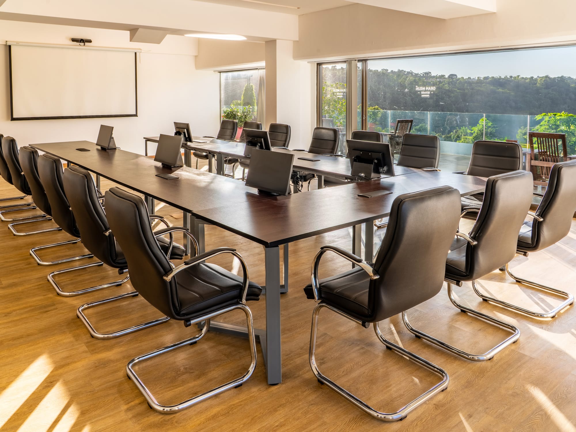 a conference room with a table and chairs