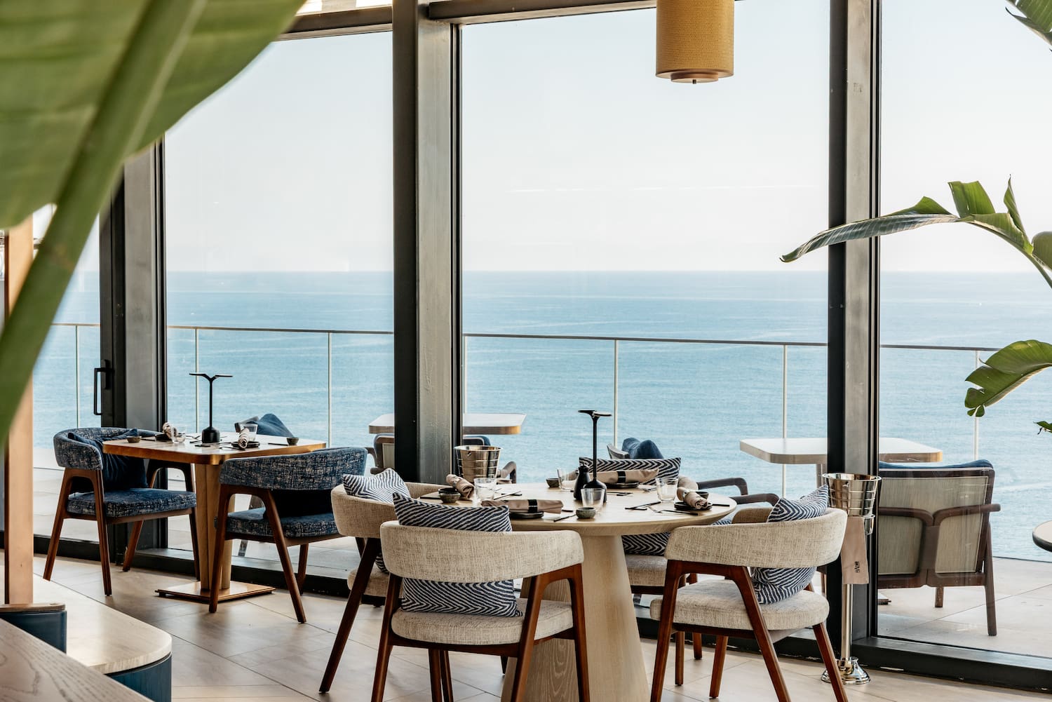 a restaurant with a view of the ocean