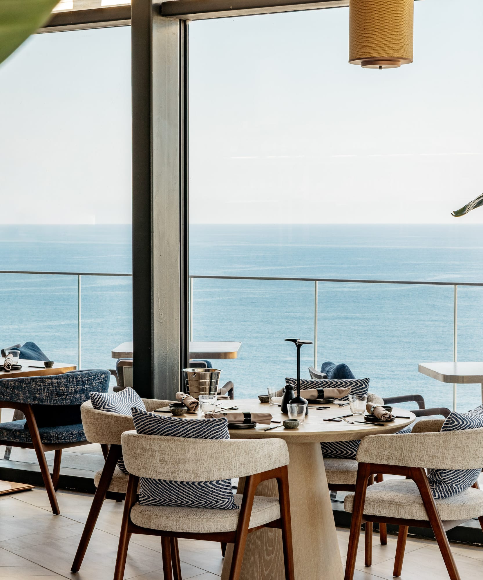 a restaurant with a view of the ocean