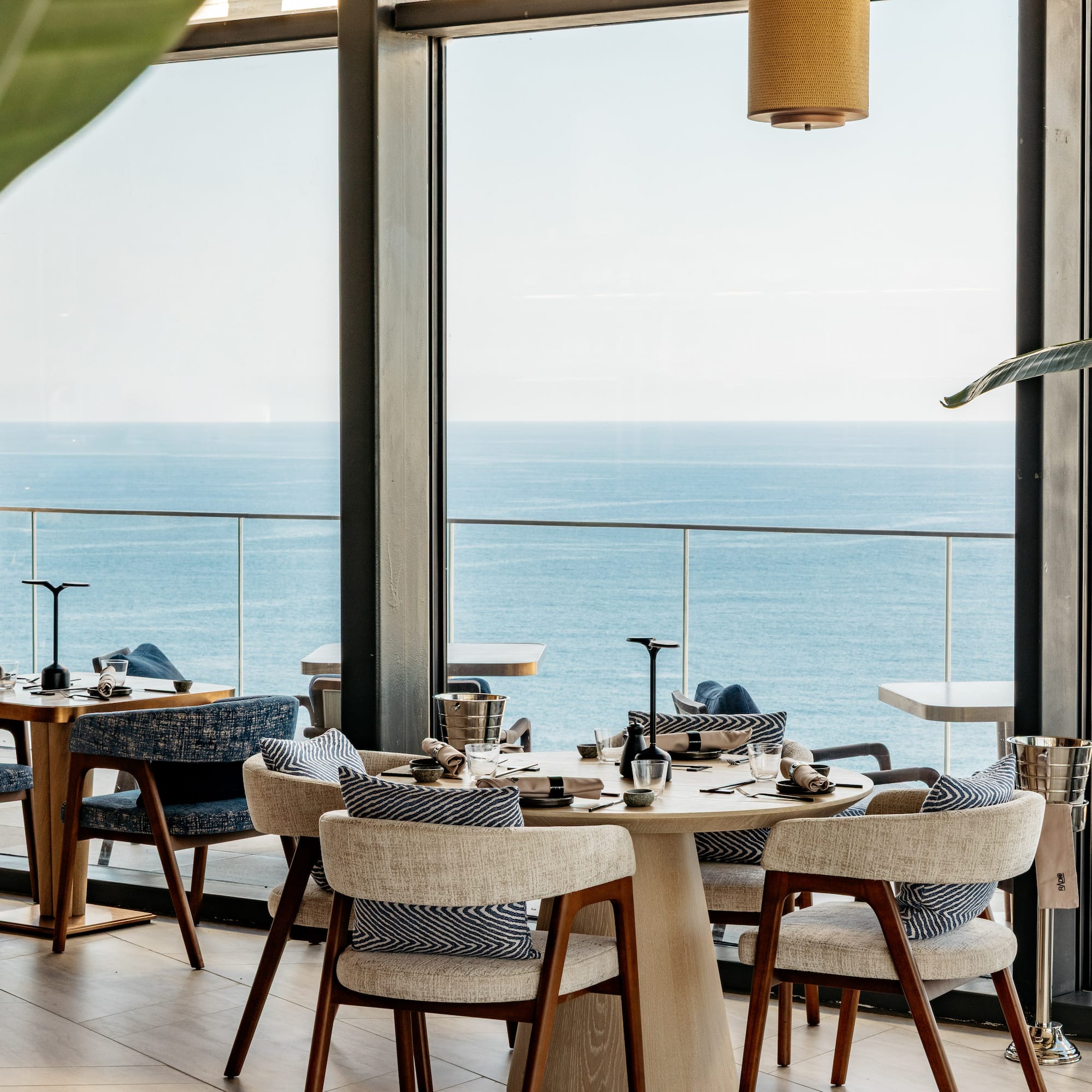 a restaurant with a view of the ocean