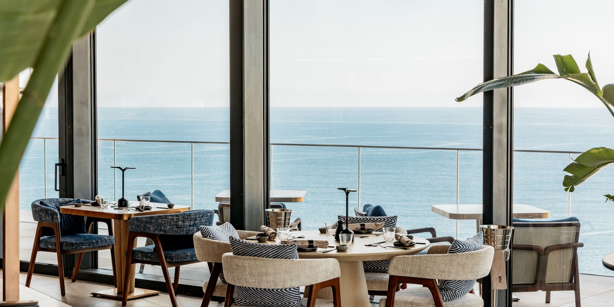 a restaurant with a view of the ocean