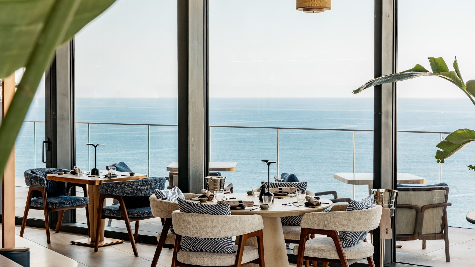 a restaurant with a view of the ocean