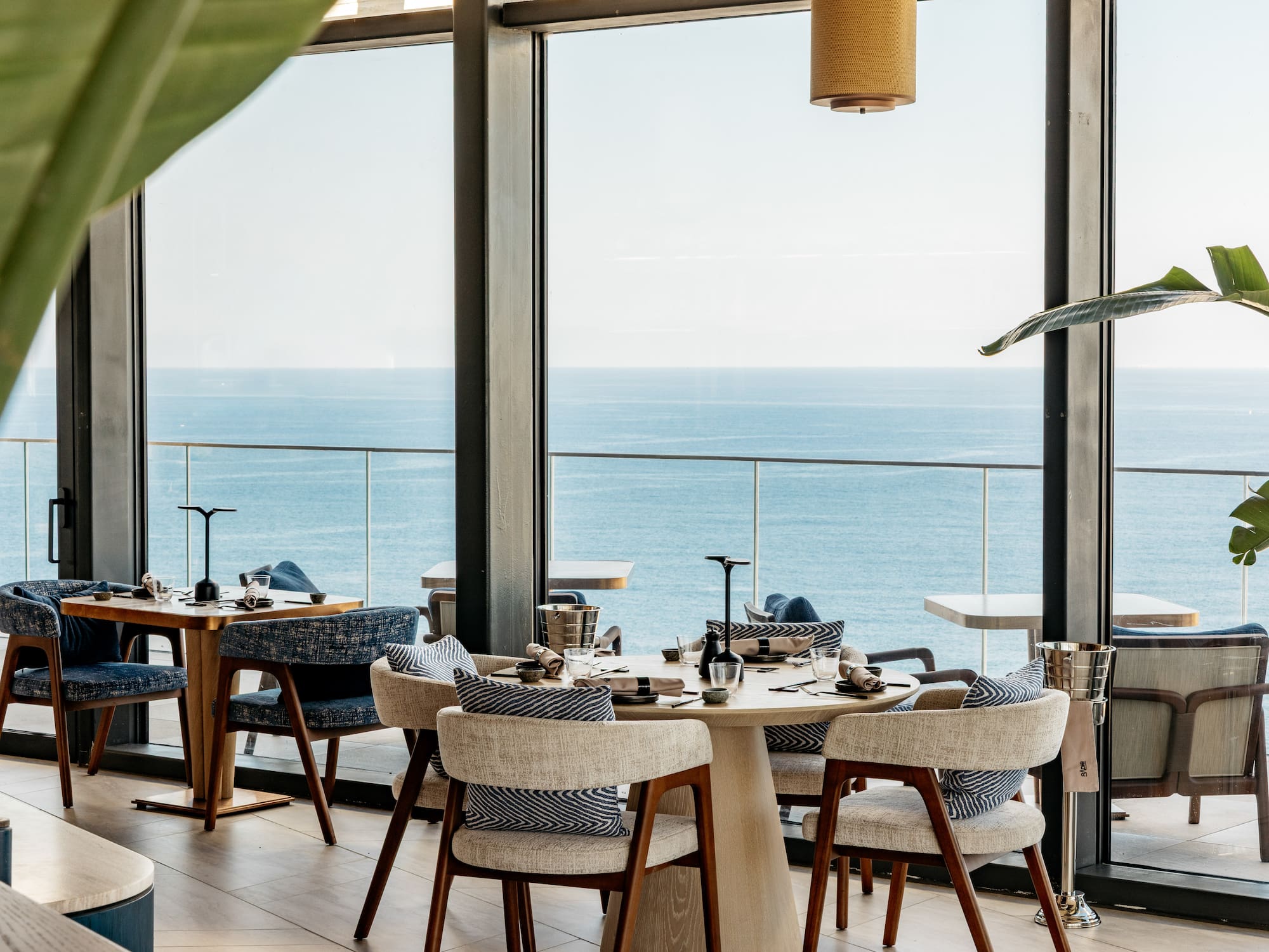 a restaurant with a view of the ocean
