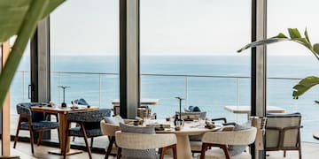 a restaurant with a view of the ocean