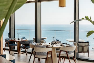 a restaurant with a view of the ocean
