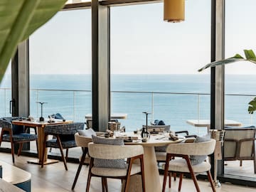 a restaurant with a view of the ocean