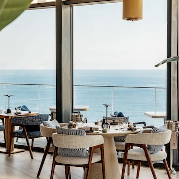 a restaurant with a view of the ocean