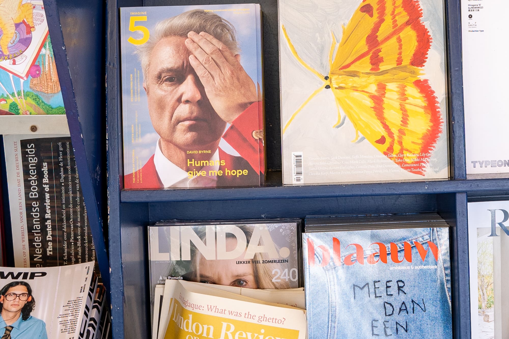 a shelf with magazines on it