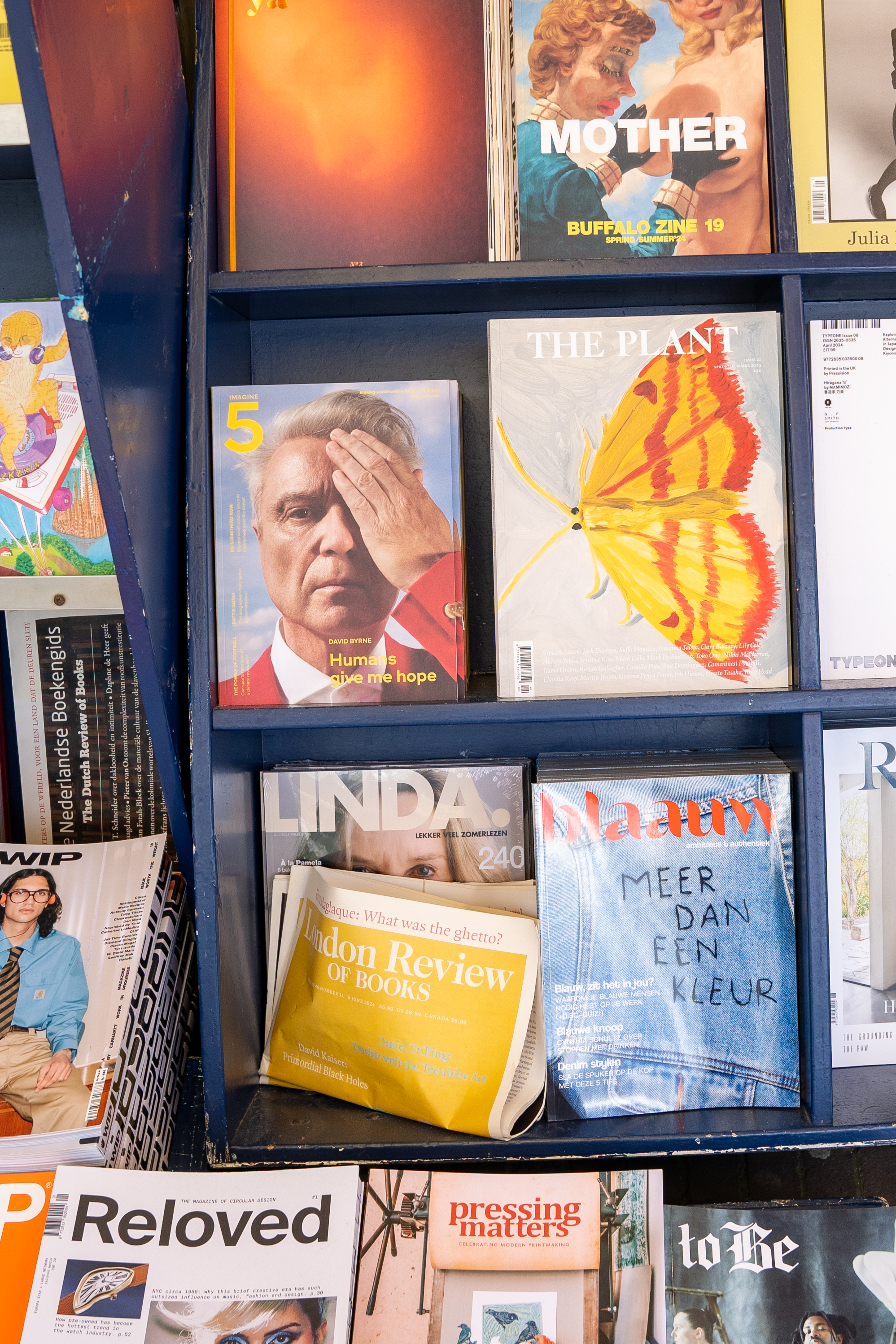 a shelf with magazines on it