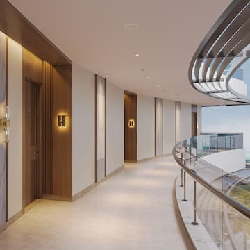 a hallway with a glass railing