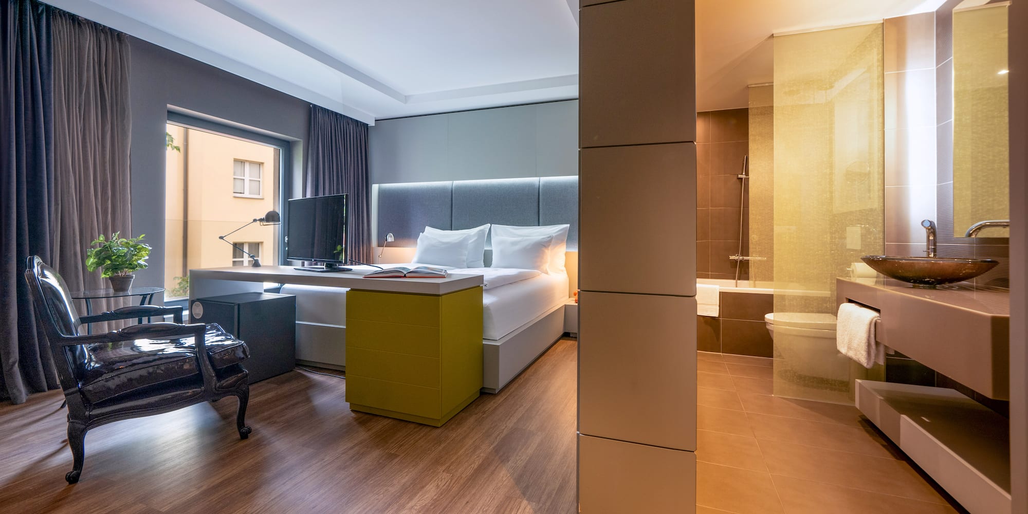 a room with a bed and a tub