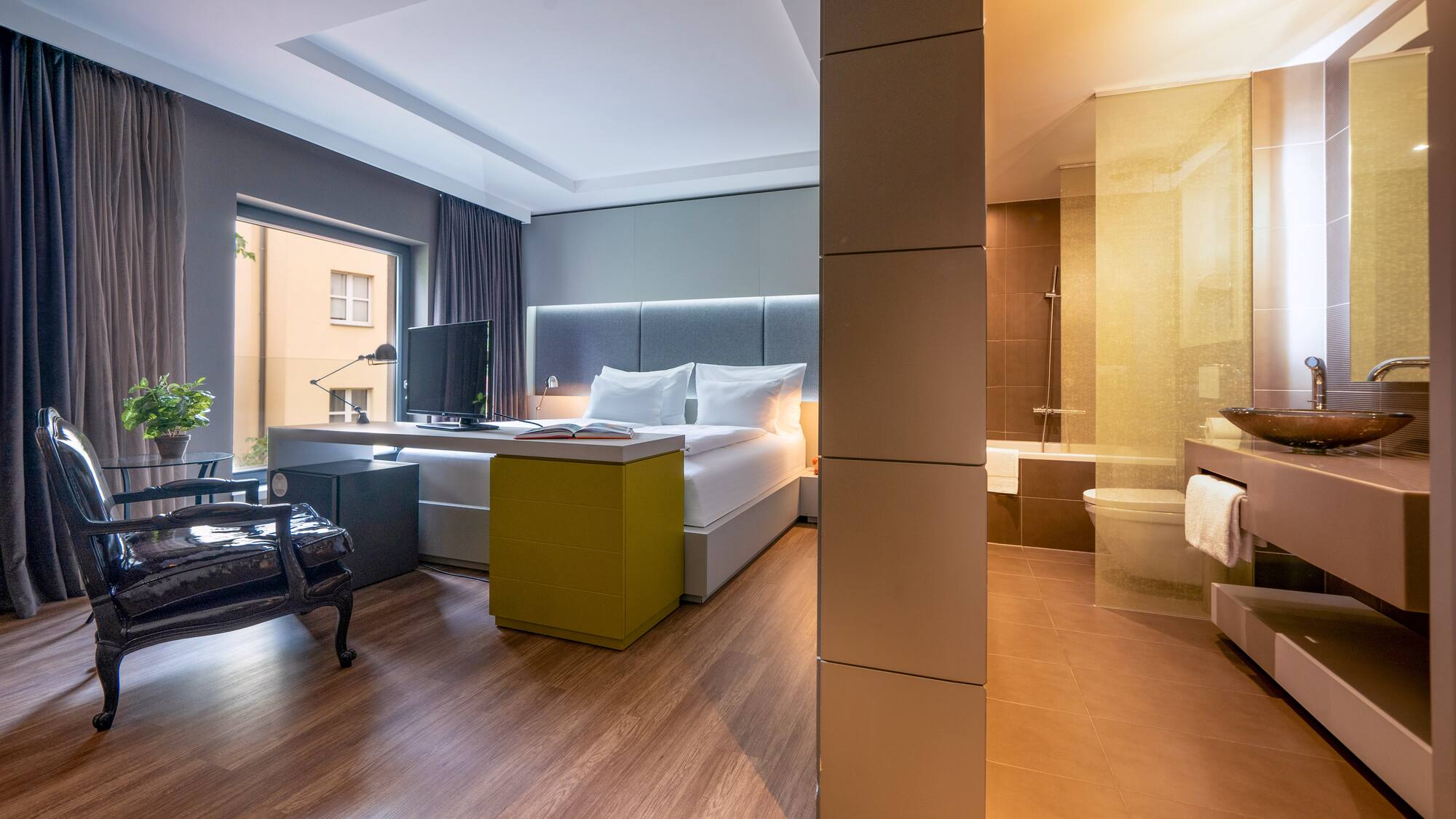 a room with a bed and a tub