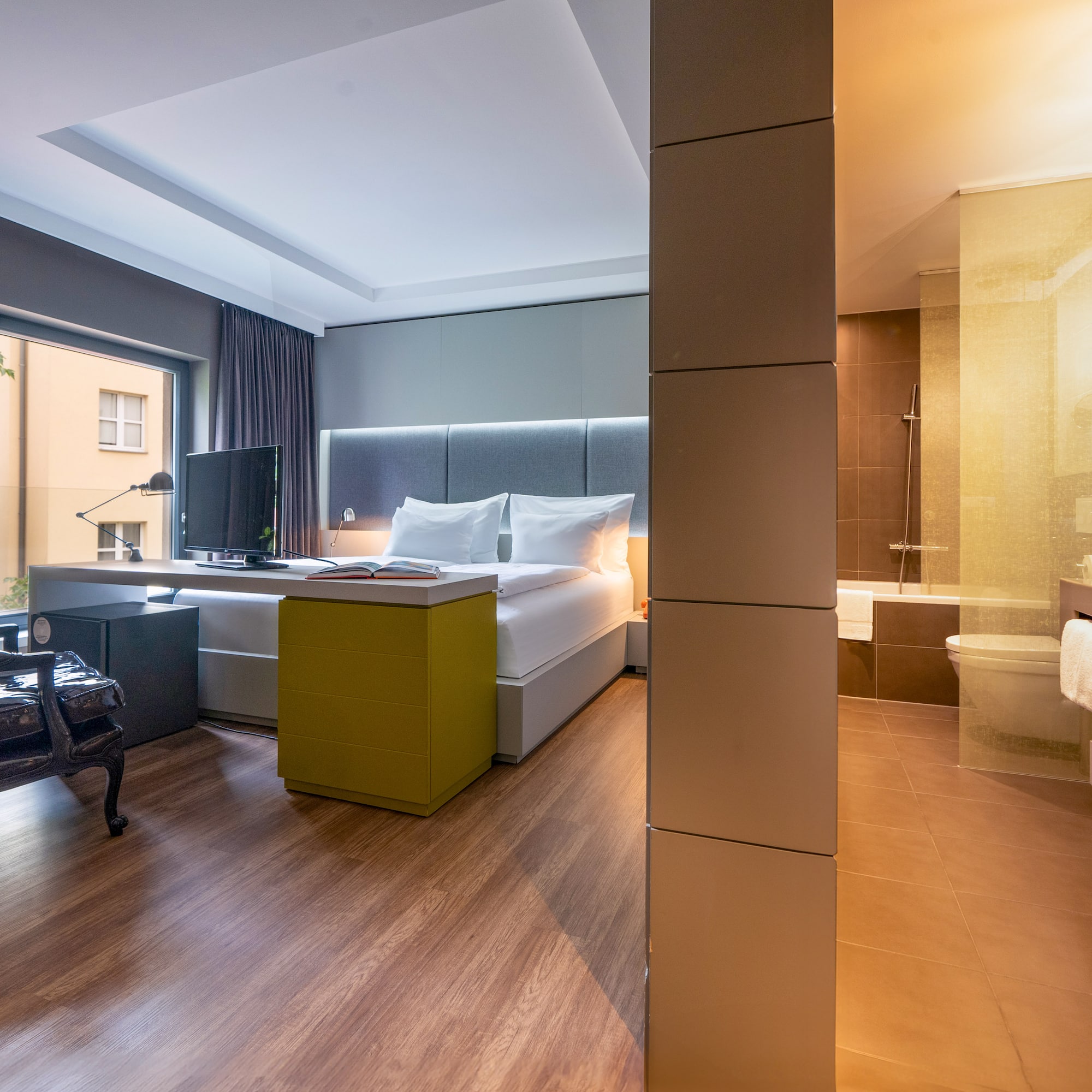 a room with a bed and a tub