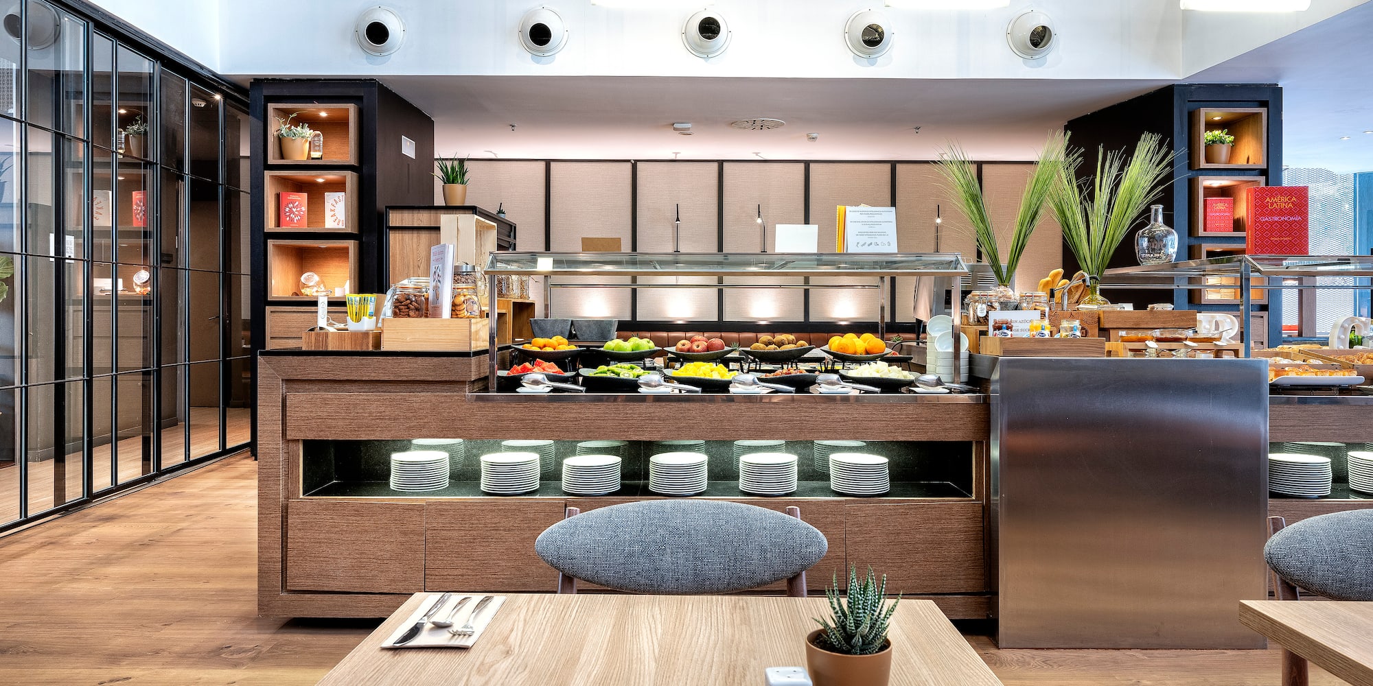 a restaurant with a table and a plant