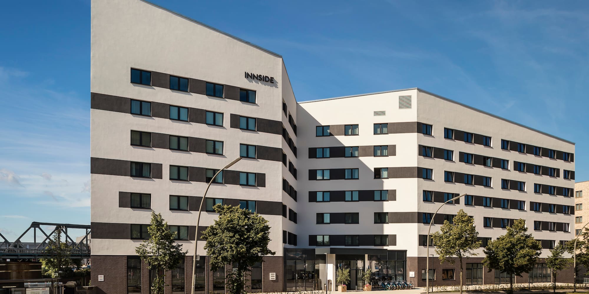 a building with trees and a street