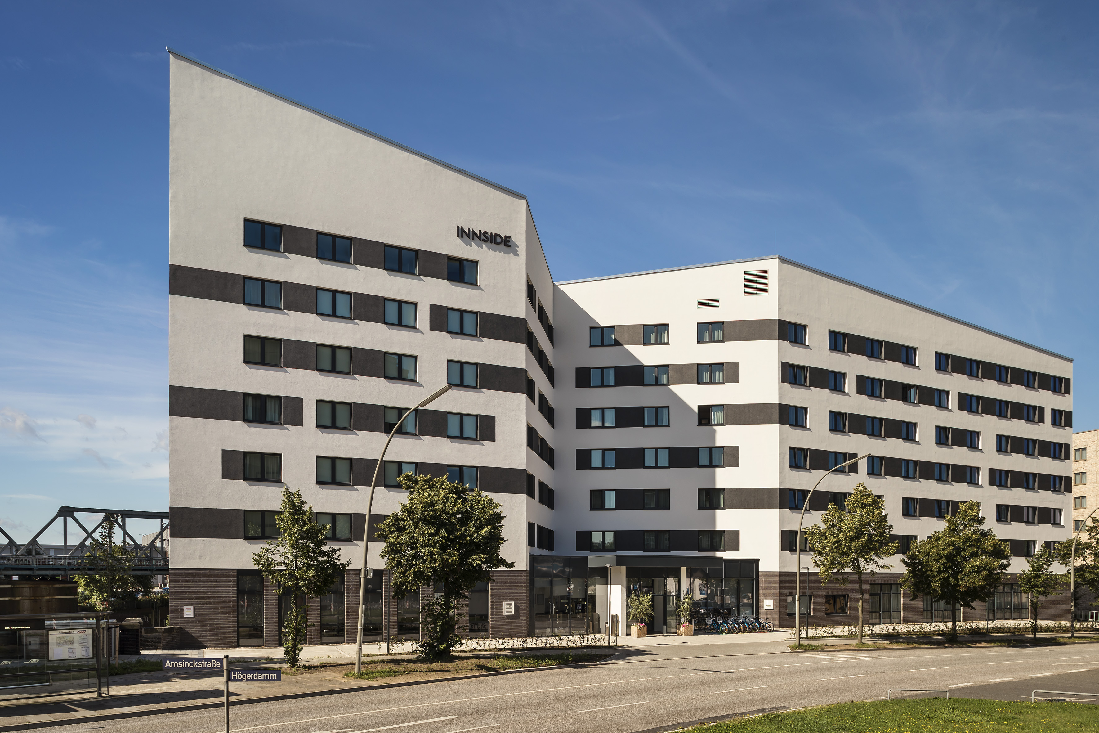 a building with trees and a street