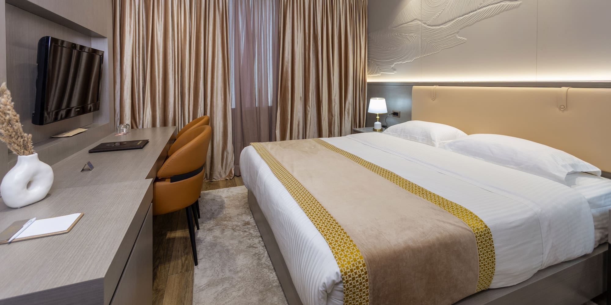 a room with a bed and a desk