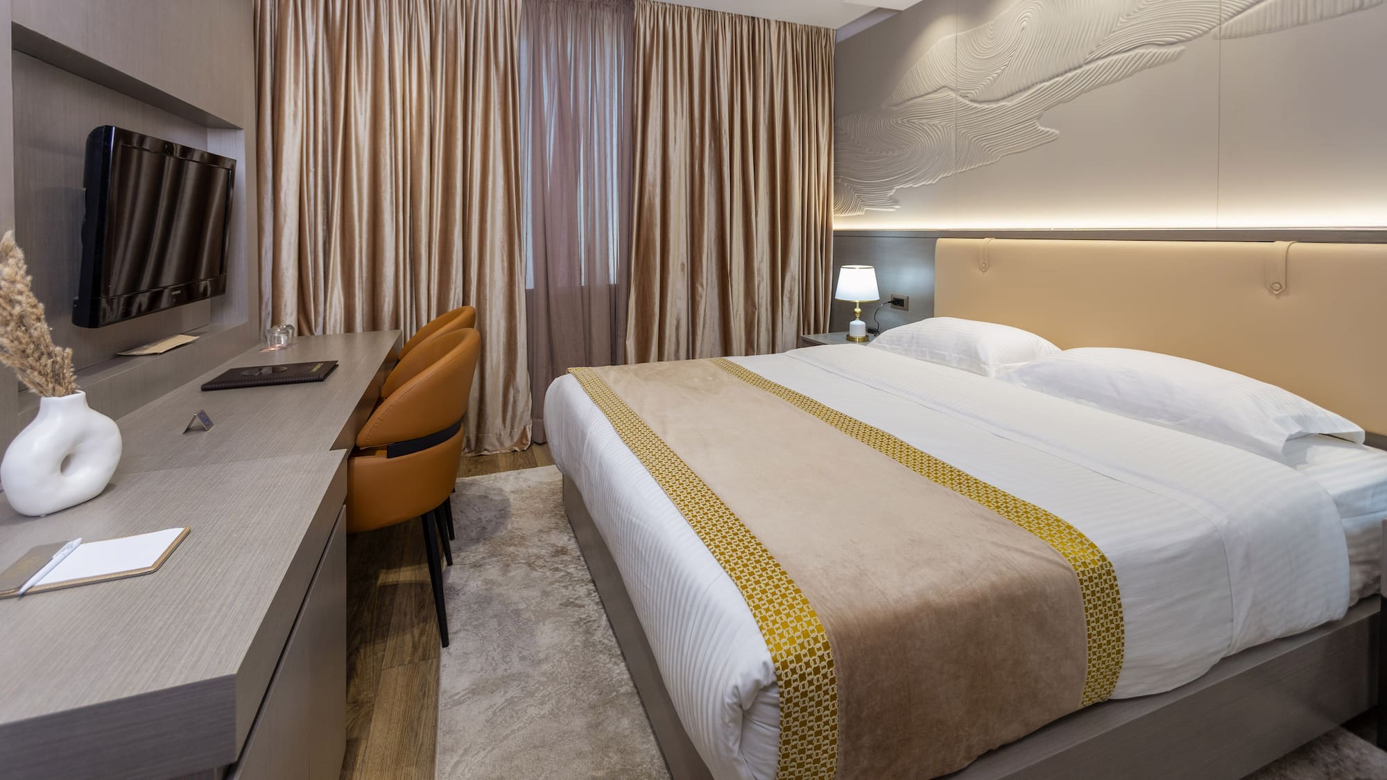 a room with a bed and a desk