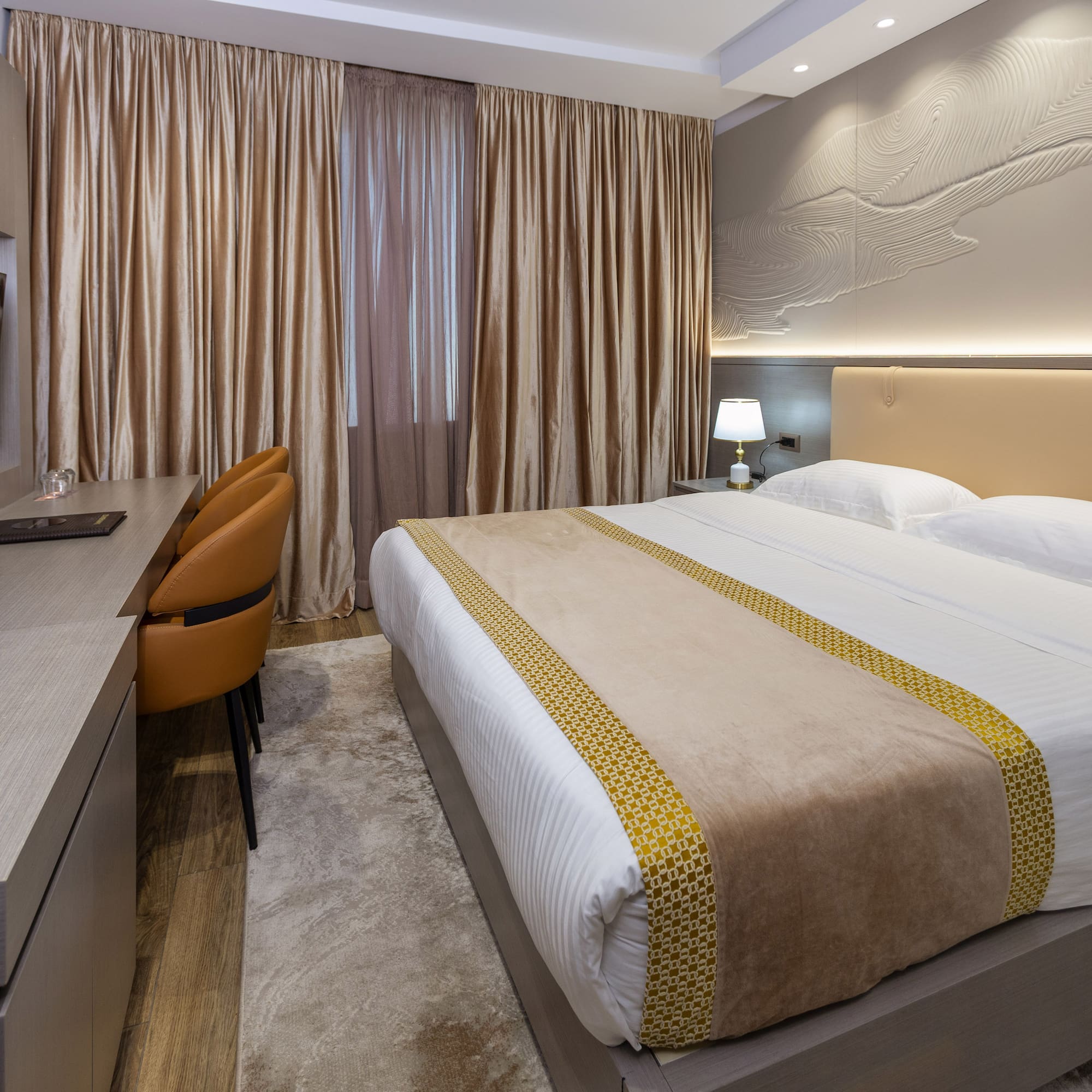 a room with a bed and a desk