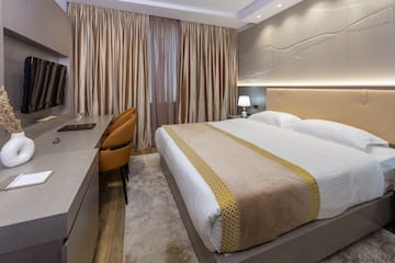 a room with a bed and a desk