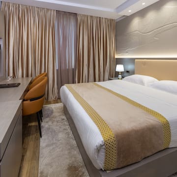 a room with a bed and a desk