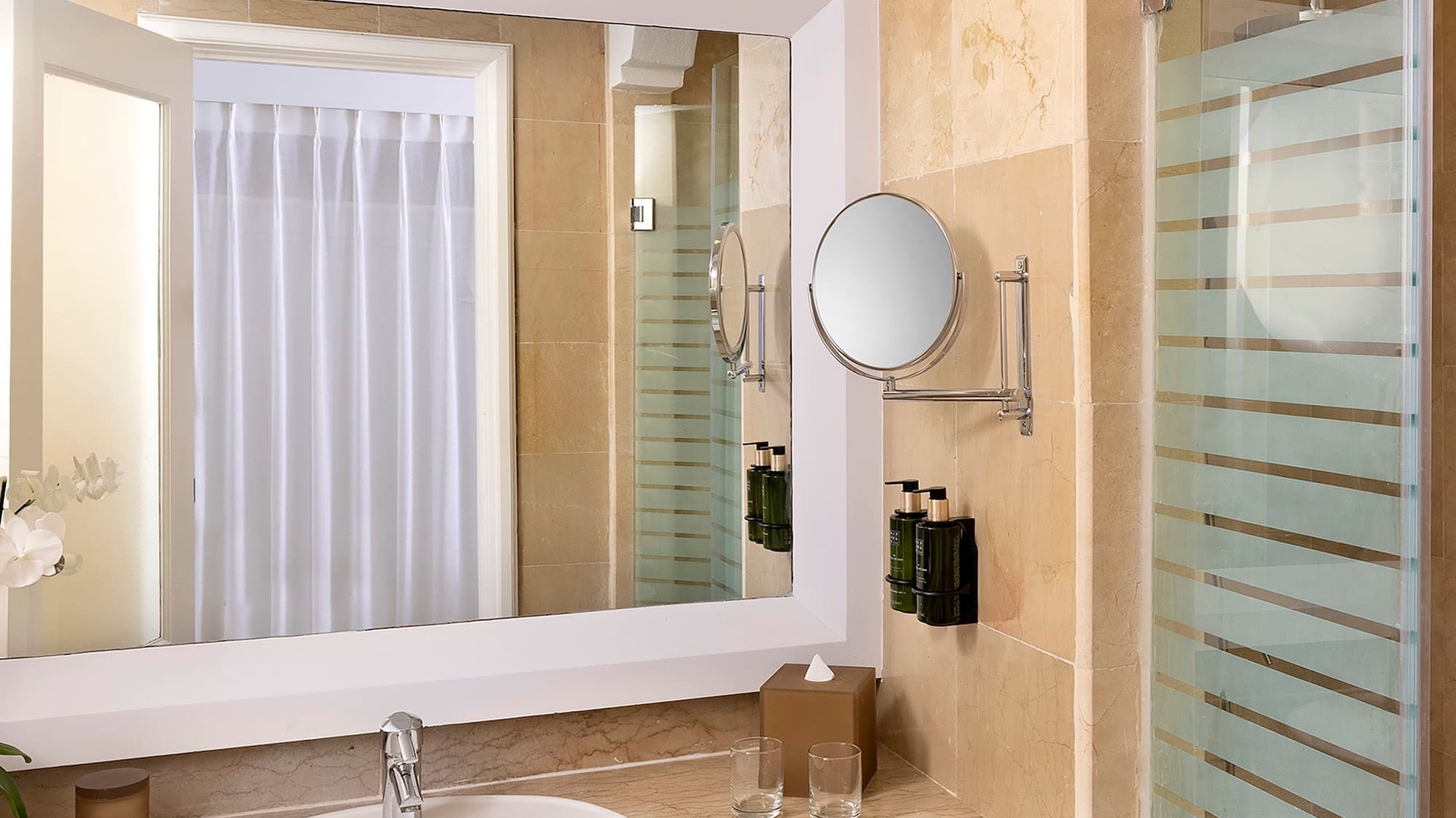 a bathroom with a mirror and sink