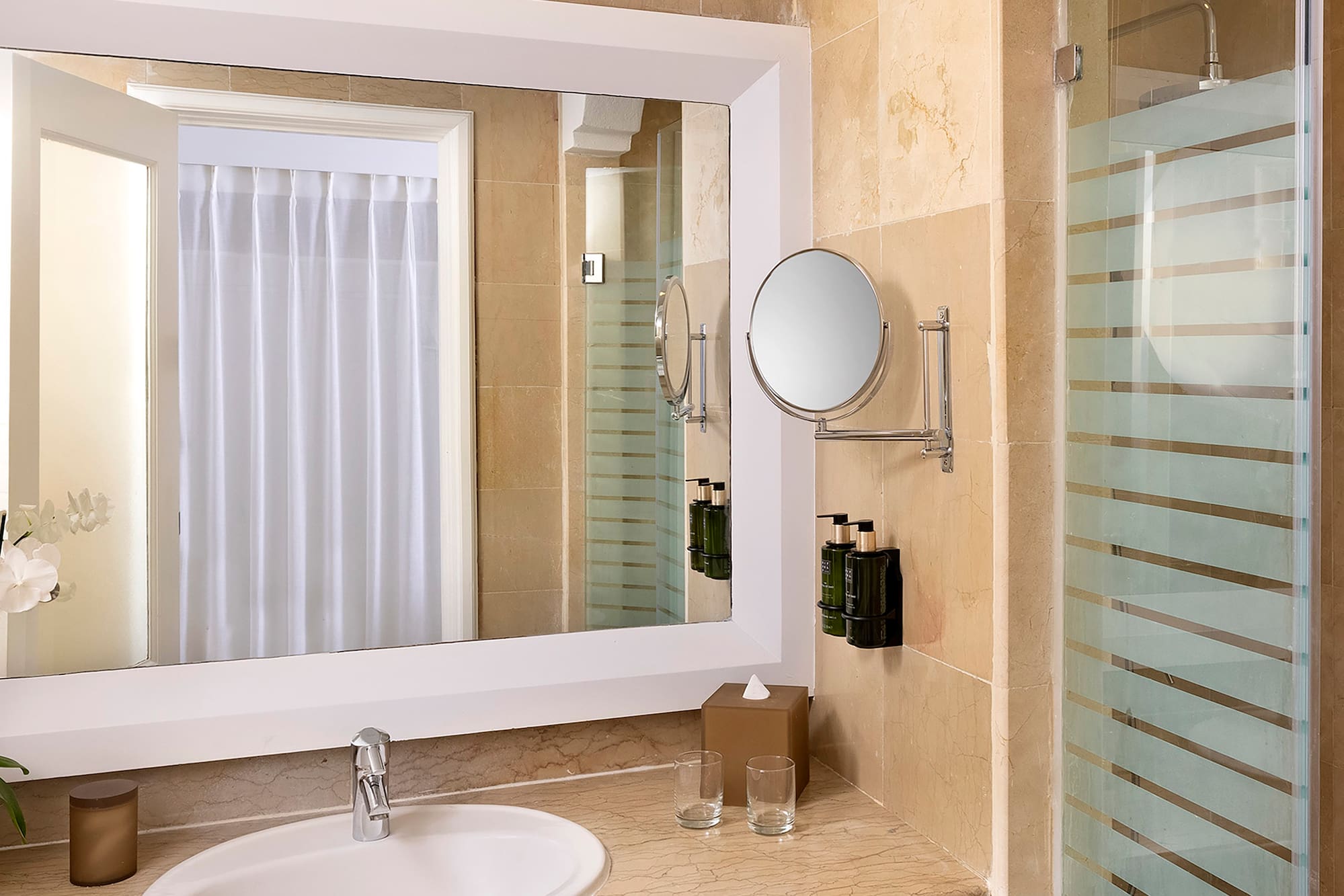 a bathroom with a mirror and sink