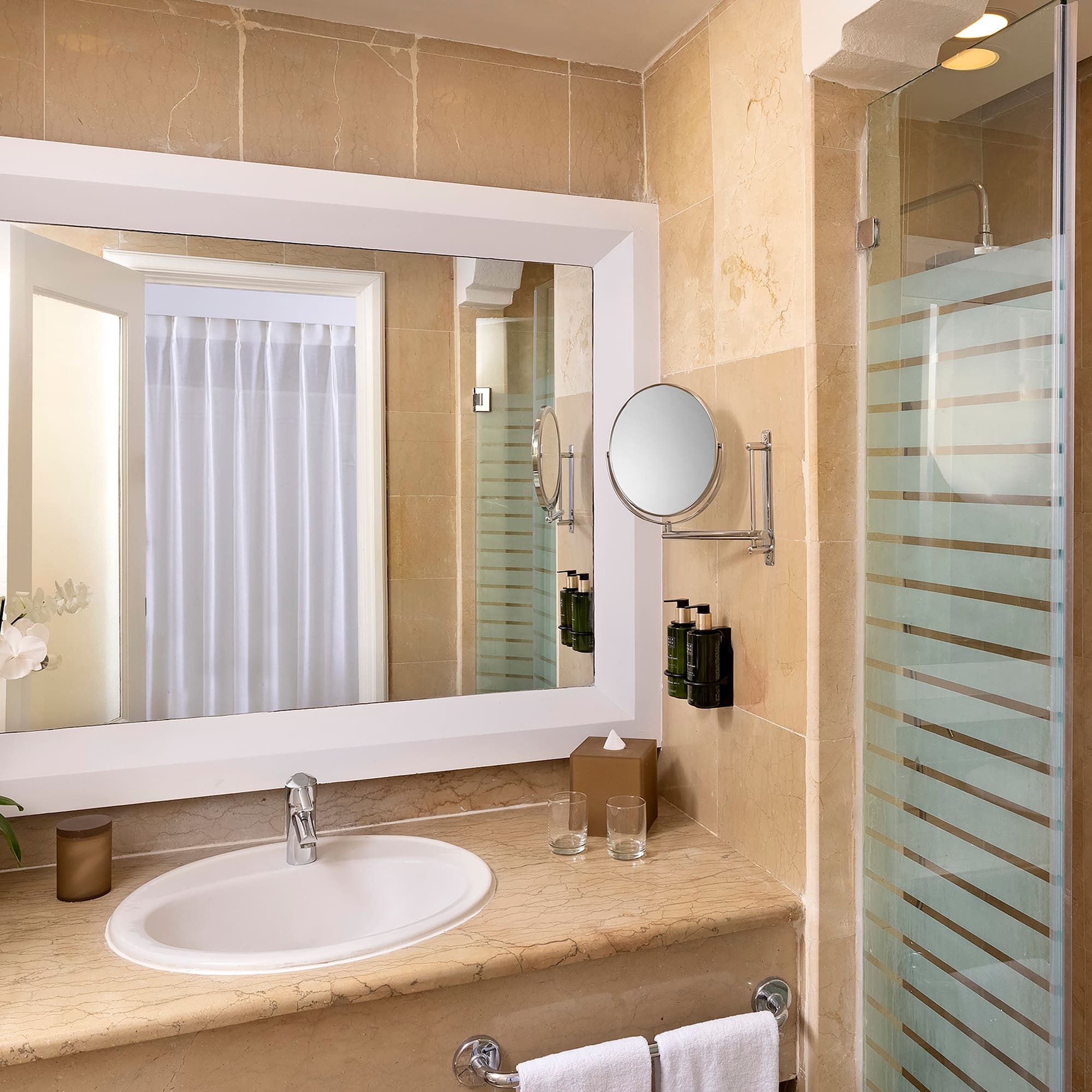 a bathroom with a mirror and sink