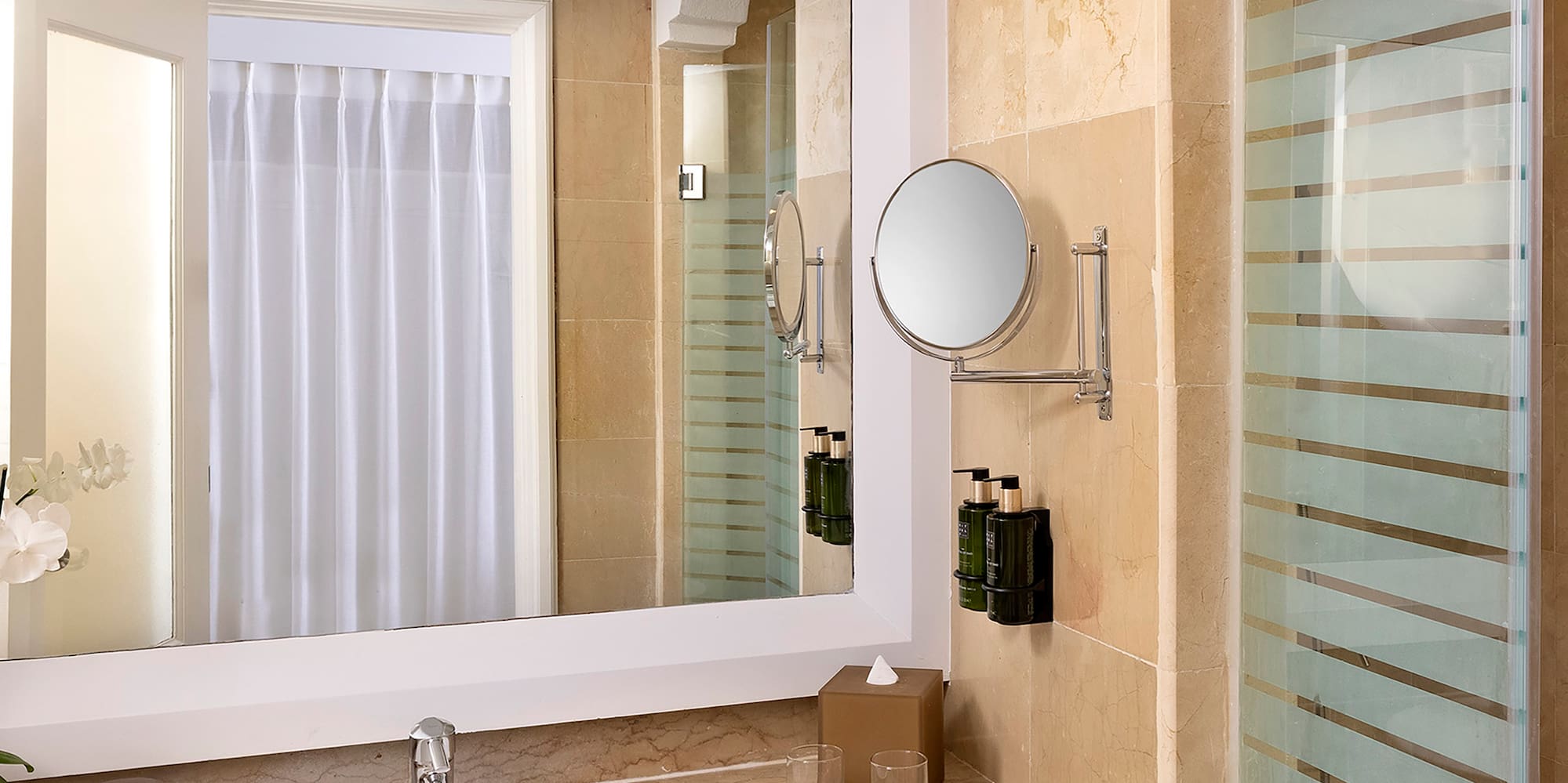 a bathroom with a mirror and sink