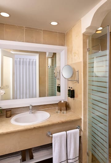 a bathroom with a mirror and sink