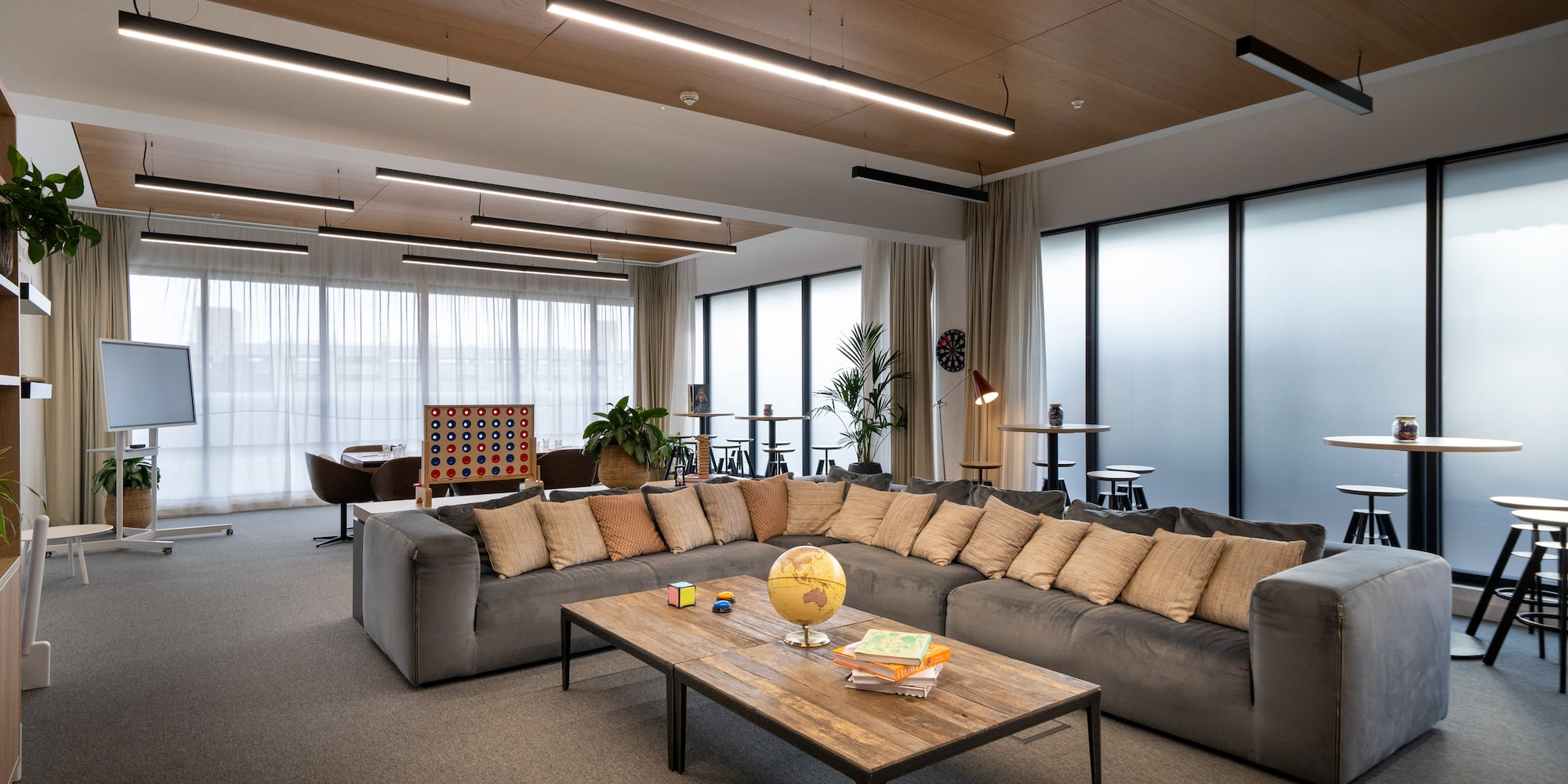 a large living room with a large couch and a table