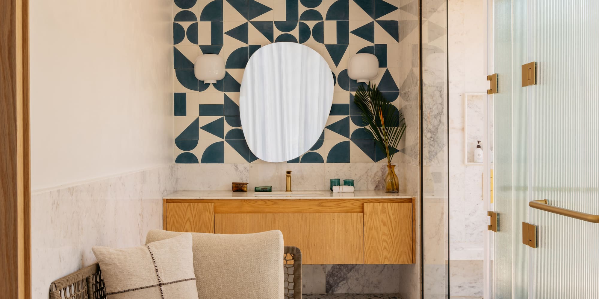 a bathroom with a mirror and a couch