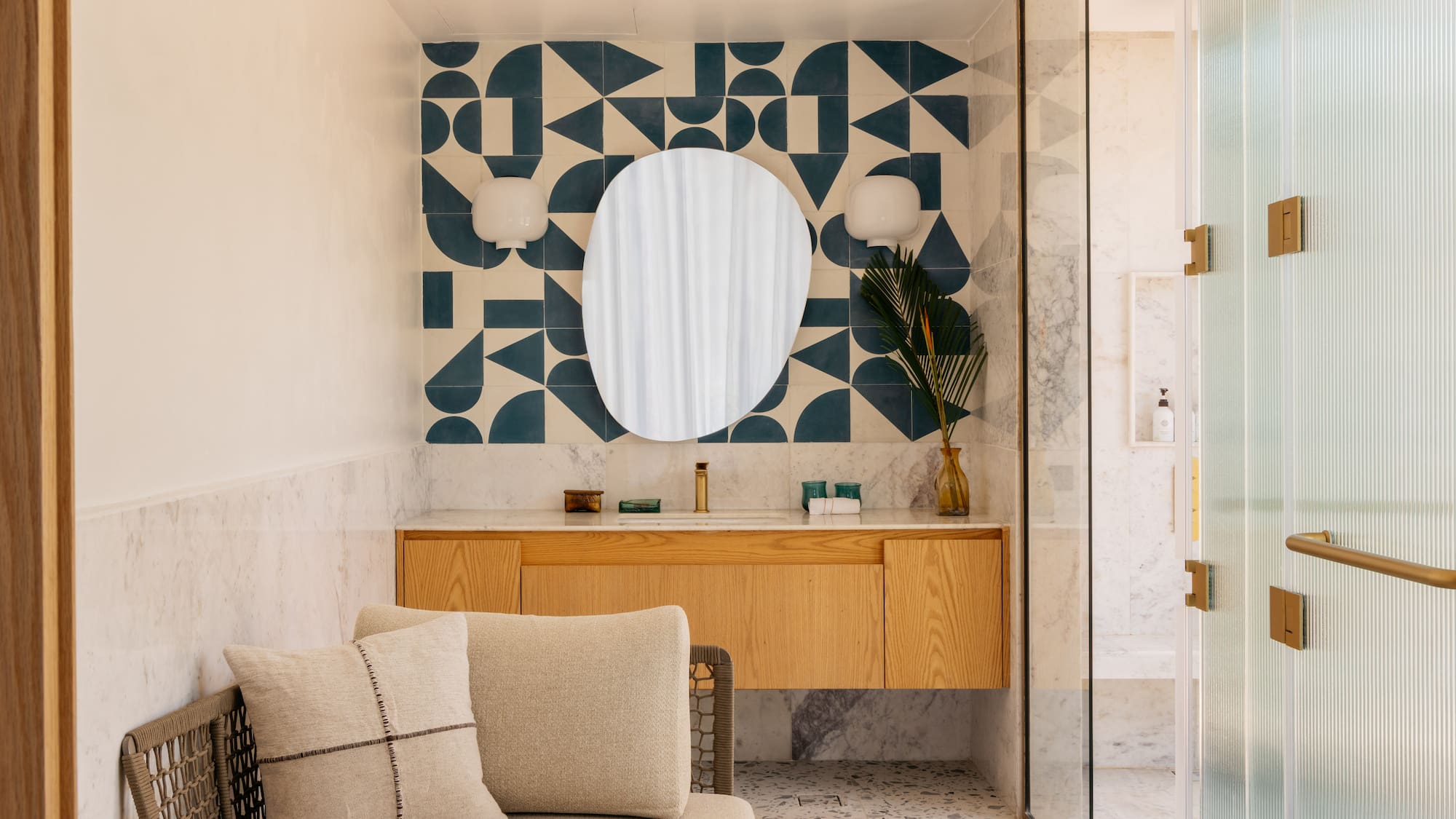 a bathroom with a mirror and a couch