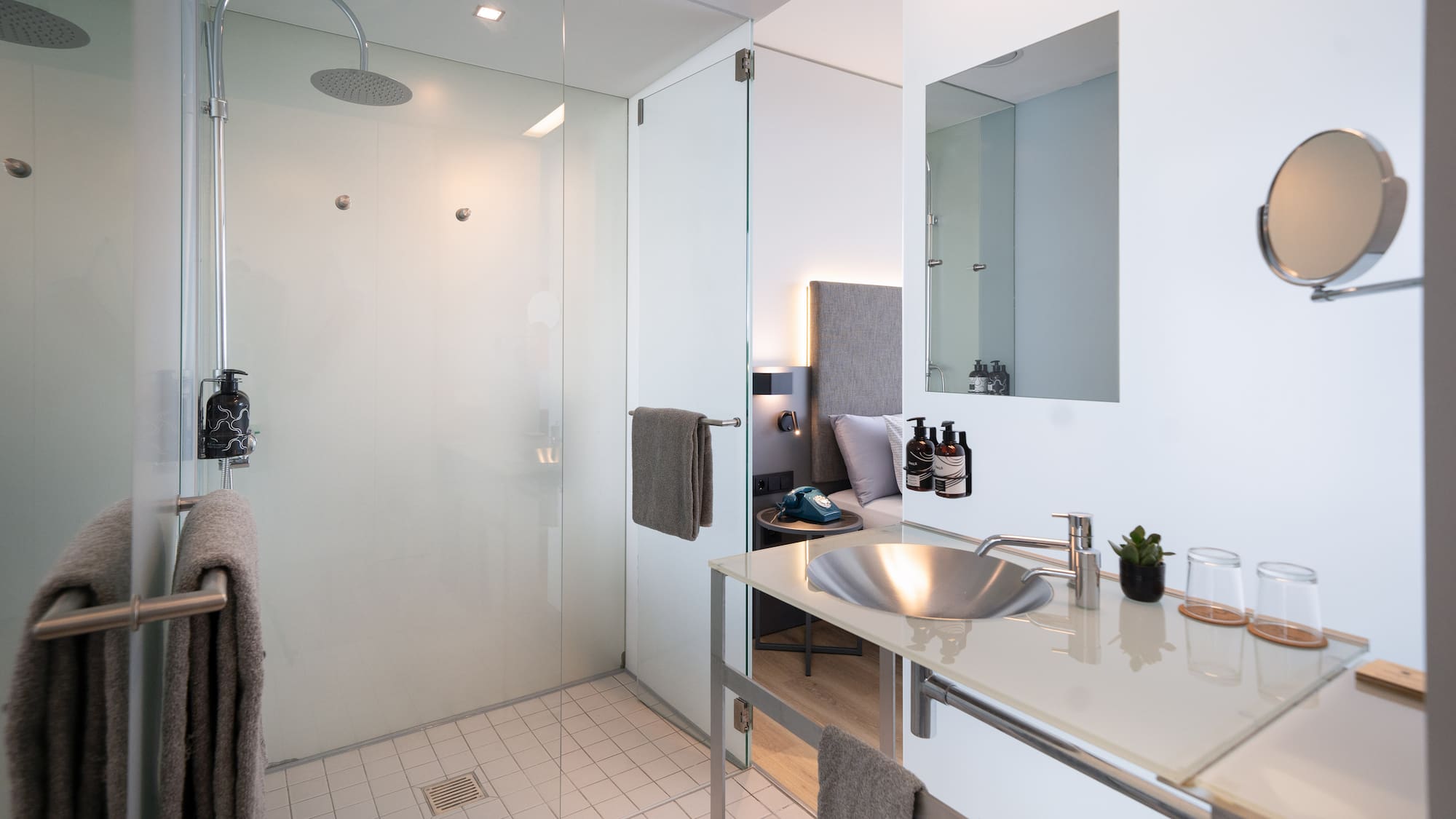 a bathroom with a shower and sink