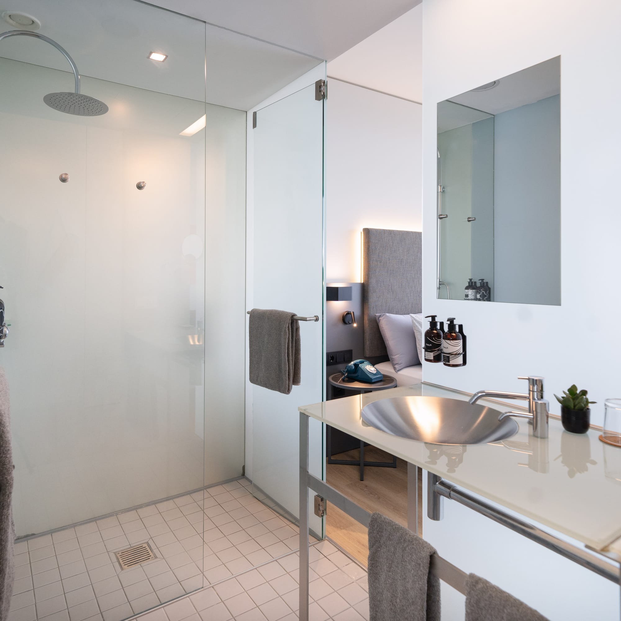 a bathroom with a shower and sink