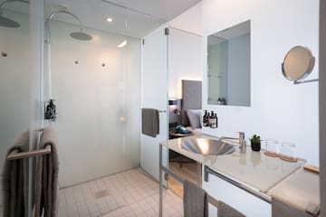 a bathroom with a shower and sink