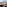 Balcony with laptop overlooking a bustling London cityscape and rooftops.