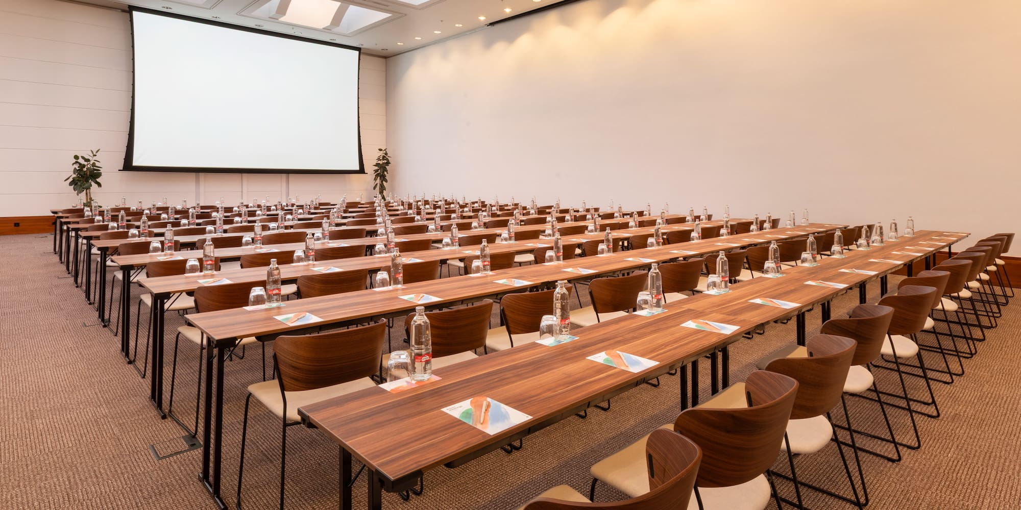 a large conference room with tables and chairs