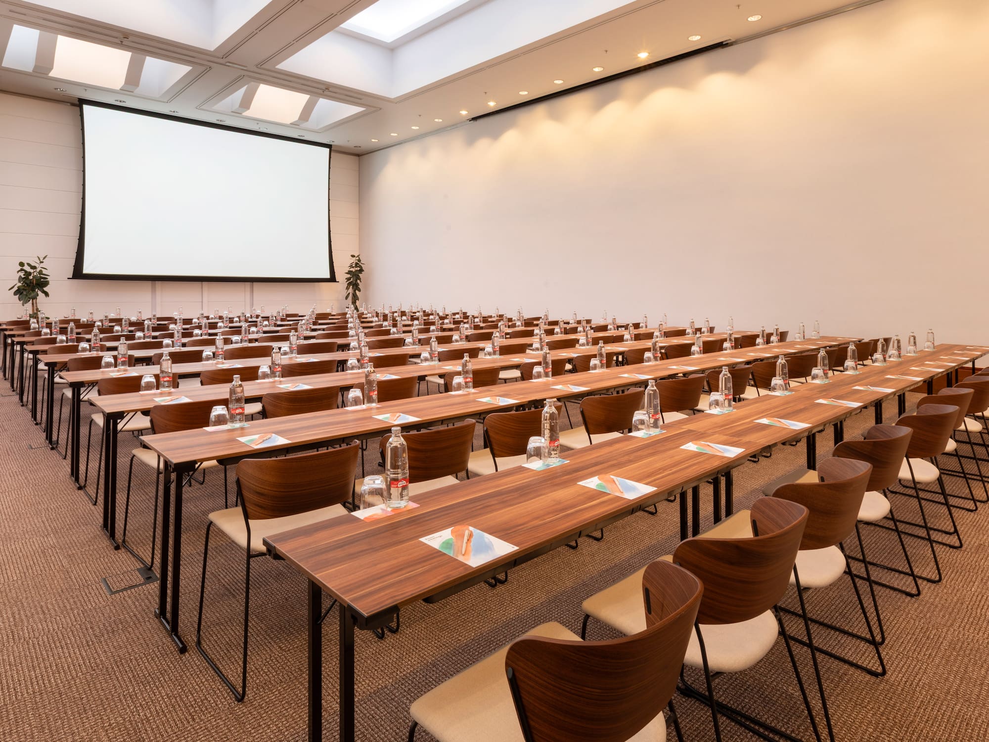 a large conference room with tables and chairs